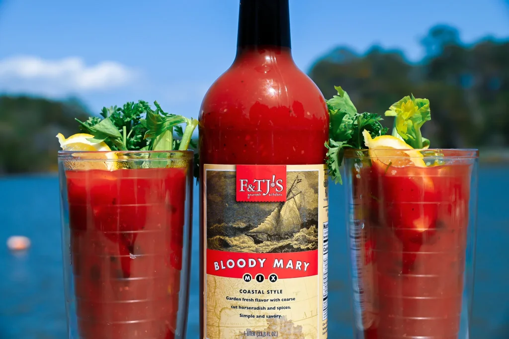 Close-up of F&TJ’s Bloody Mary Mix bottle label with cocktail garnishes.