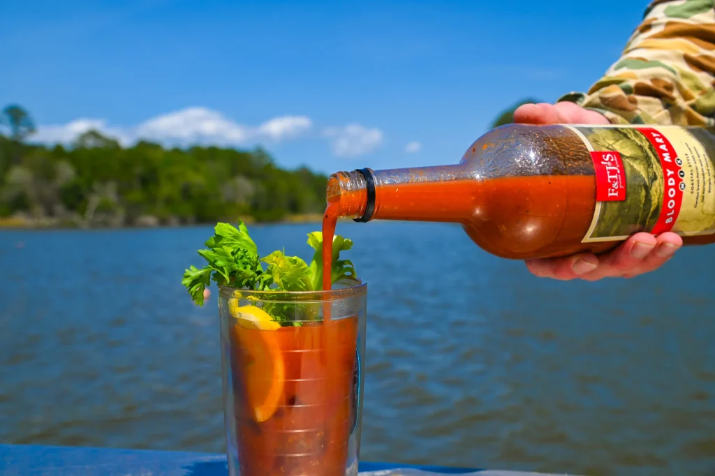 Pouring a Bloody Mary on a boat in North Carolina with F&TJ’s spicy mix