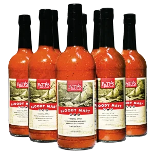 12-pack case of F&TJ'S Carolina Bloody Mary Mix 1-liter bottles on a transparent background.