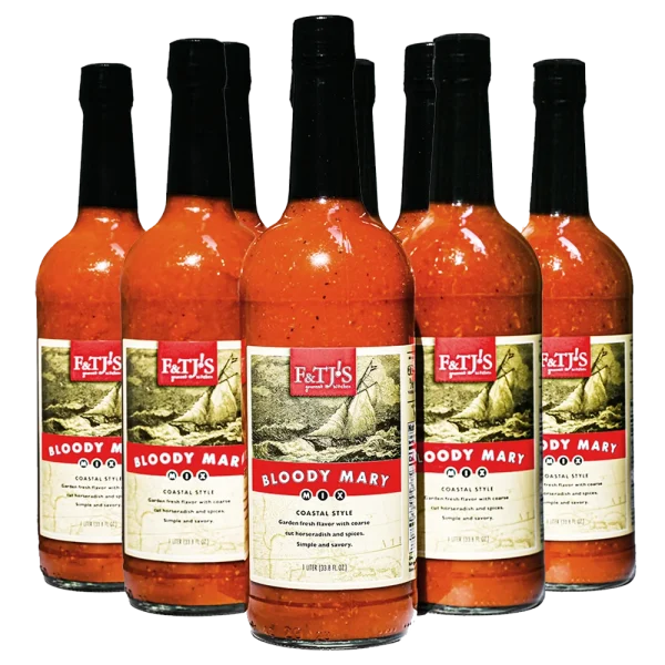 12-pack case of F&TJ'S Carolina Bloody Mary Mix 1-liter bottles on a transparent background.